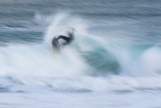 A surfer hits the end section at St Kilda, Dunedin, New Zealand.Credit: www.boxoflight.com/Derek Morrison