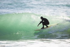 Simon Dickie tucks up tight on the North Coast, Dunedin, New Zealand.Credit: www.boxoflight.com/Derek Morrison