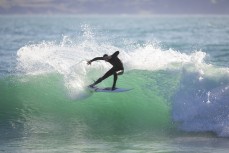 Leon Santorik makes the most of a fun swell as it wraps into the North Coast, Dunedin, New Zealand.Credit: www.boxoflight.com/Derek Morrison