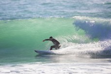 Luke Murphy powers through a bottom turn on the North Coast, Dunedin, New Zealand.Credit: www.boxoflight.com/Derek Morrison