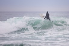 Craig Higgins floats a section in cold winter waves at Blackhead, Dunedin, New Zealand.
Credit: www.boxoflight.com/Derek Morrison