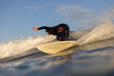 Tash Civil on rail during a clean winter swell at St Kilda, Dunedin, New Zealand.Credit: www.boxoflight.com/Derek Morrison