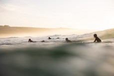 Surfers paddle back out during a clean winter swell at St Kilda, Dunedin, New Zealand.Credit: www.boxoflight.com/Derek Morrison