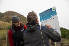 Jordana Whyte, of the New Zealand Sea Lion Trust, and Jim Fyfe, of Doc update a sign to let beach users know about sea lions in the area. Hooper's Inlet, Dunedin, New Zealand.
Credit: www.boxoflight.com/Derek Morrison