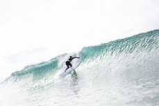 A surfer drops into a clean wall at Aramoana, Dunedin, New Zealand.