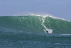 Davy Wooffindin rides a big wave at a remote reefbreak in southern New Zealand surfing the same swell that produced a record 23.8m wave to the south of Stewart Island on May 8, 2018. 