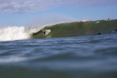 Larry Fisher makes the most of a spring swell hits The Ledge at Manu Bay, Raglan, Waikato, New Zealand.