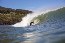 Caleb Cutmore sets up during a spring swell at The Ledge at Manu Bay, Raglan, Waikato, New Zealand.