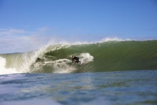 Nathan Banks winds down the line during a spring swell at The Ledge at Manu Bay, Raglan, Waikato, New Zealand.