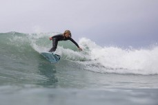 Keo Morrison (11) makes the most of waves at a surf break near Kaikoura, New Zealand. Photo: Derek Morrison
