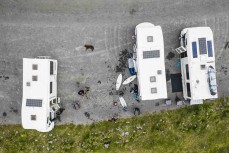 Campervan surfers at a surf break near Kaikoura, New Zealand. Photo: Derek Morrison