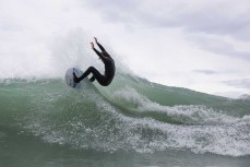 Myka Black makes the most of waves at a surf break near Kaikoura, New Zealand. Photo: Derek Morrison
