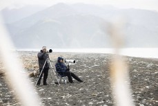 Photographers Cory Scott and Warren Hawke during the 2020 New Zealand Scholastics Surfing Championship held at a surf break near Kaikoura, New Zealand. Photo: Derek Morrison