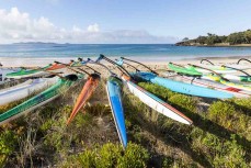 Waka on the beach during the Pearl of the North waka ama race held near Te Tii, Northland, New Zealand.