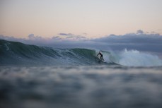 Surfers make the most of fun waves near Oakura, New Plymouth, Taranaki, New Zealand.