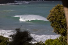 A summer swell wraps into a remote break in the Catlins, New Zealand. Photo: Derek Morrison