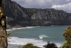 A summer swell wraps into a remote break in the Catlins, New Zealand. Photo: Derek Morrison