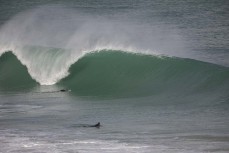 A summer swell wraps into a remote break in the Catlins, New Zealand. Photo: Derek Morrison