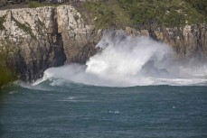 A summer swell pounds cliff faces in the Catlins, New Zealand. Photo: Derek Morrison