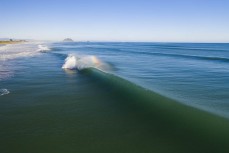 A cyclone swell arrives at Papamoa, Mount Maunganui, New Zealand.