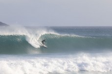 A surfer drops into a clean wave during a solid swell at St Kilda, Dunedin, New Zealand.Credit: www.boxoflight.com/Derek Morrison