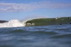 Larry Fisher makes the most of a spring swell at The Ledge at Manu Bay, Raglan, Waikato, New Zealand.