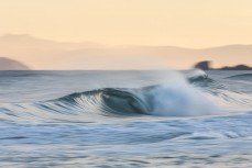 Clean hollow waves at St Kilda, Dunedin, New Zealand.