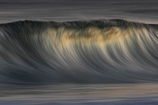 Clean hollow waves at St Kilda, Dunedin, New Zealand.