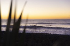 Dawn on finals day during the 2021 Kaikoura Grom Comp held at a surf break near Kaikoura, New Zealand. Photo: Derek Morrison
