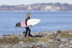 Rewa Morrison with a new board at a surf break near Kaikoura, New Zealand. Photo: Derek Morrison
