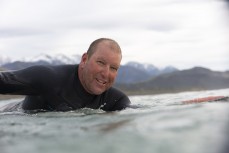 Local lad Dave Lyons enjoys a surf in his backyard near Kaikoura, New Zealand. Photo: Derek Morrison