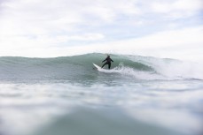 Levi Stewart unwinds duiring a session at a surf break near Kaikoura, New Zealand. Photo: Derek Morrison