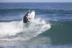 Lyndon Fairbairn hard at work testing the C-Skins ReWired 3:2 at St Clair, Dunedin, New Zealand.Credit: www.boxoflight.com/Derek Morrison