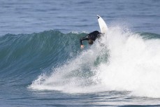 Lyndon Fairbairn hard at work testing the C-Skins ReWired 3:2 at St Clair, Dunedin, New Zealand.Credit: www.boxoflight.com/Derek Morrison