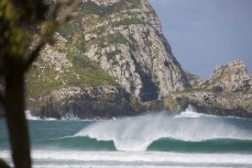 Early season swell at a remote beachbreak in the Catlins, New Zealand. 