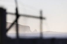 Dawn through the fence at St Clair, Dunedin, New Zealand.
Credit: www.boxoflight.com/Derek Morrison