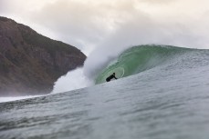 Jonas Tawharu gets barrelled during a fun east swell at Aramoana, Dunedin, New Zealand.