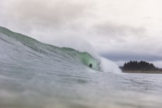 A surfer gets barrelled during a fun east swell at Aramoana, Dunedin, New Zealand.