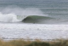 Jonas Tawharu finds a barrel during a fun east swell at Aramoana, Dunedin, New Zealand.