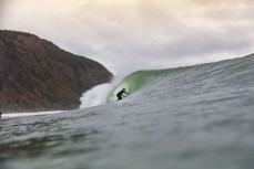Jonas Tawharu finds a barrel during a fun east swell at Aramoana, Dunedin, New Zealand.