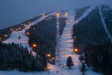 Skiing on dusk during winter at Tomamu, Japan.