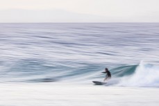 A surfer makes the most of a wave at a break near Coolangatta on the Gold Coast, Queensland, Australia.