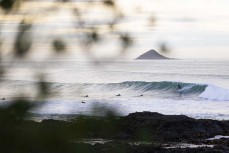 Skep races a wall as a rare point break lines up during a clean swell near Dunedin, New Zealand.Credit: www.boxoflight.com/Derek Morrison