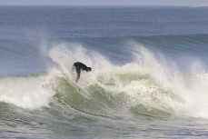 Bernardo Matzenbacher cracks the end section as the storm swell abates at Blackhead, Dunedin, New Zealand.Credit: www.boxoflight.com/Derek Morrison