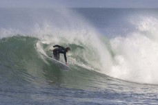 Mike McNally makes the most of a wave as the storm swell abates at Blackhead, Dunedin, New Zealand.Credit: www.boxoflight.com/Derek Morrison