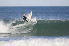 Keo Morrisoin gets vertical as the storm swell abates at Blackhead, Dunedin, New Zealand.Credit: www.boxoflight.com/Derek Morrison