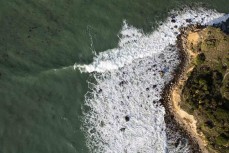 Aerial view during a surf at a break on the north coast, Dunedin, New Zealand. Photo: Derek Morrison