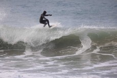 Luke Griffin floats a section during a winter session on the North Coast, Dunedin, New Zealand.Credit: www.boxoflight.com/Derek Morrison