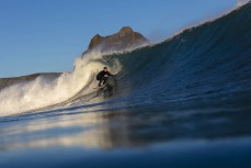 Darren Eade draws a line on a clean wall at Blackhead, Dunedin, New Zealand.