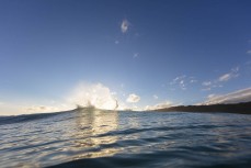 Jamie Civil sends some spray in clean waves during a winter session at Blackhead, Dunedin, New Zealand.